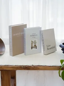 Detailed view of modern decorative fake book set for coffee table and shelf decor.