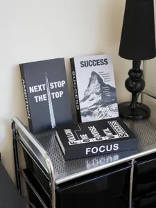 Minimalist black and white decorative fake book model for modern home and office decor.
