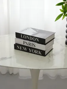 Decorative faux book set featuring London, Paris, and New York designs for modern home decor.