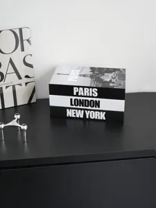 Detail view of modern black and white decorative city theme fake book storage box model.