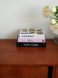 Decorative fake books set for coffee table, modern city design storage book for home decor.