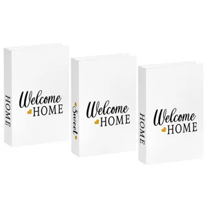 Detailed shot of white decorative fake book set with welcome home text for modern room decor.