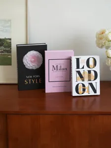 Minimalist decorative fake book set featuring New York, Milan, and London designs for home.