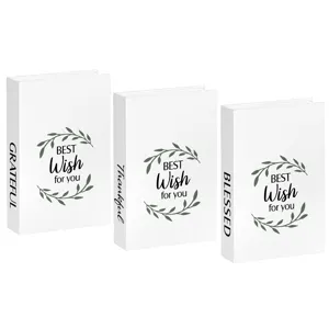 White decorative fake books set with botanical leaf wreath design for modern home shelf decor.