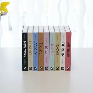 Decorative fake books set with colorful city fashion themes, perfect for modern bookshelf decor.
