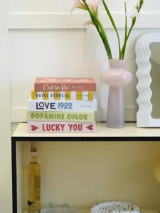 Modern cream style decorative fake book set with stylish English typography for home decor.