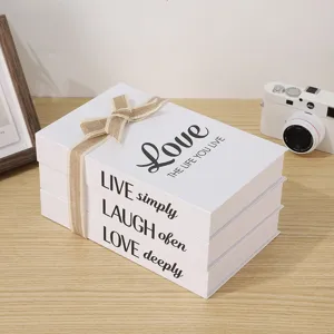 White decorative fake books set with English quotes and bow, perfect for home and cafe decor.