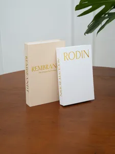 Decorative fake book set with linen texture and gold stamping for modern home interior decor.