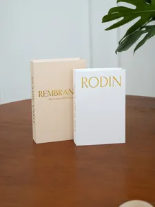Decorative fake books with linen texture and gold foil lettering, modern home decor book models.