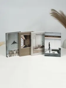 Close-up of decorative fake book props set, wabi-sabi style earth tone modern book model.