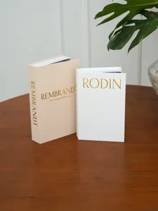 Scatola portaoggetti decorativa in finto libro con trama in lino per tavolino.