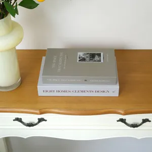 Modern decorative fake book for home decor, stylish faux book prop for interior display.