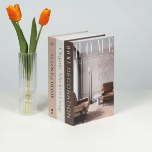 Nordic minimalist decorative books set with transparent glass vase and orange tulips for home decor.