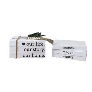 Rustic decorative fake book storage box set with twine and leaf decor for cozy home desktop.