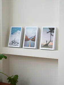 Decorative fake books set with inspirational quotes, modern minimalist home shelf display ornaments.
