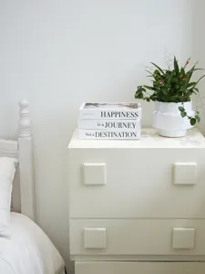Minimalist decorative fake books set with English inspirational quotes for home decor display.