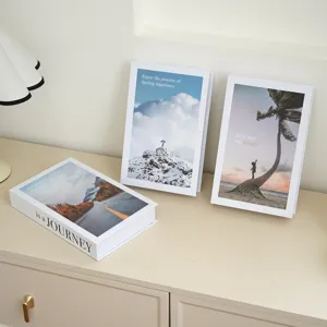 Decorative fake books with inspirational English quotes for modern home and office desk decor.