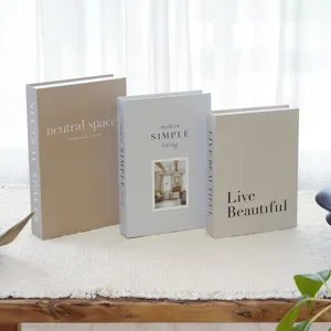 Decorative faux books for modern home coffee table decor, aesthetic stackable display style.