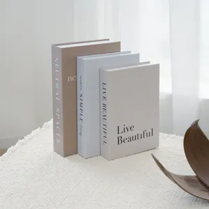 Modern decorative faux books set for coffee table shelf home interior styling design.