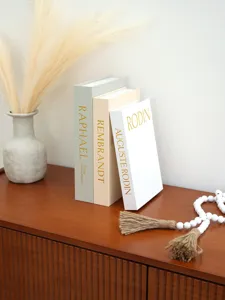 Decorative fake books storage box set with linen texture and gold foil artist names for home decor.