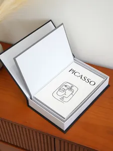 Detailed view of openable decorative book storage box with Picasso art line design.