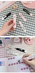 Mini cutter con garra de gato para abrir paquetes, manualidades y material escolar.