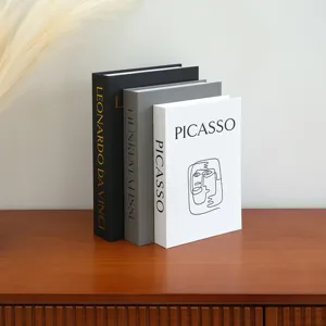 Decorative fake book storage boxes with linen texture and artist designs for home decor.