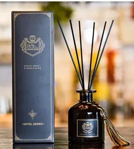 Black glass reed diffuser set with elegant packaging box, ideal for home fragrance decor.