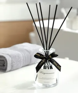 Hotel series reed diffuser bottle with black sticks and decorative ribbon, 120ml room fragrance.