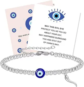 Silver beaded evil eye charm bracelet displayed on a meaningful blessing message card