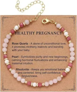 Detailed macro shot of a rose quartz and pearl beaded bracelet on a kraft gift card