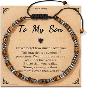 Macro detail of tiger eye and hematite beaded bracelet with gift message card for son