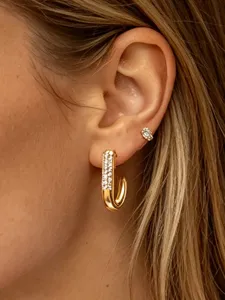 Stunning gold-plated J-shaped hoop earrings featuring sparkling pave crystals for women.