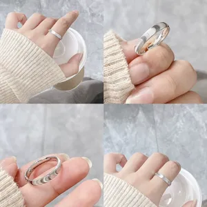 Minimalist silver wavy ring detail, sleek stainless steel ring worn on hand showcase.