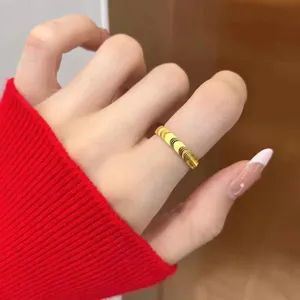 Minimalist gold wave ring for couples, stylish titanium steel metal finger jewelry accessory.