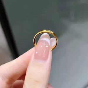 Minimalist gold titanium steel ring with chic wavy texture, elegant couple jewelry accessory.