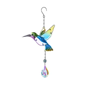 Detailed view of colorful metal glass hummingbird suncatcher hanging crystal pendant.