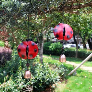 Metal ladybug wind chime detail, hanging garden decor bell, outdoor yard ornament.