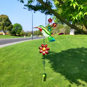 Metal glass hummingbird wind chime hanging ornament for outdoor garden yard decoration detail.