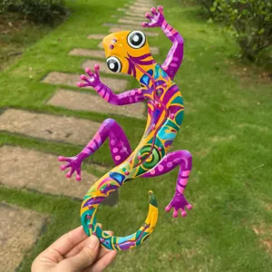 Detailed shot of a colorful metal lizard wall art, vibrant hand-painted outdoor decor.