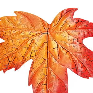 Iron maple leaf wall hanging art detail close-up, crackle texture home garden decor.