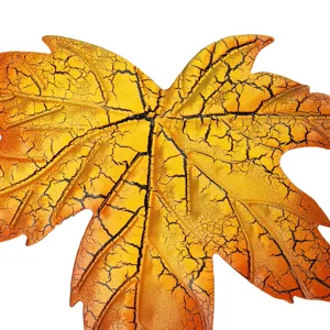 Iron maple leaf wall hanging detail, decorative art with crackle finish for home decor.