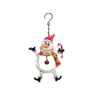 Close-up detail of the painted iron snowman hanging ornament with a cute candy cane and bell.