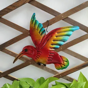 Metal hummingbird wall hanging detail showing rainbow gradient finish and texture.