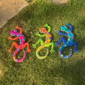 Colorful metal gecko wall art hanging, vibrant lizard sculpture for indoor and outdoor decor.