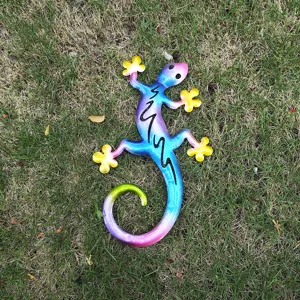 Colorful metal gecko wall art detail, vibrant painted finish with hollow cutouts for decor.