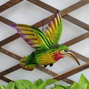 Metal hummingbird wall decor detail, vibrant multi-color finish, perfect for garden outdoor hanging.