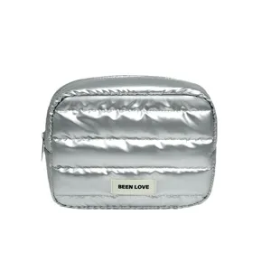 Silver metallic puffer cosmetic bag, quilted travel makeup pouch with zipper and handy design.