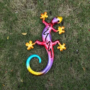 Detailed view of colorful metal gecko wall art, outdoor garden sculpture lizard hanging decoration.