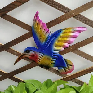Colorful metal hummingbird wall art close-up, vibrant gradient garden hanging decor detail.